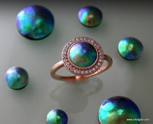 Diamond set halo ring with BluePearl surrounded by other BluePearls